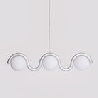 Clérachic Citheis three-head chandelier in silver, globes seated in a continuous wave rail.