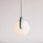 The Clérachic Citheis single pendant unlit, showing the soft green-grey hooked arm.