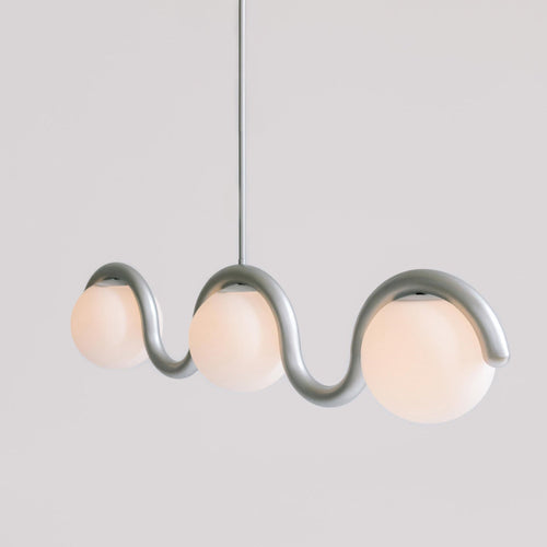 Clérachic Citheis three-head chandelier in silver on grey, globes nested in each curve.