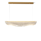Cut out on white, this Clérachic pendant light shows its gold canopy bar, two thin suspension wires and a clear, rippled shade.