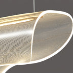 Close view of the clear, dotted acrylic shade on this Clérachic pendant light, its curled end edged with a bright strip of light.