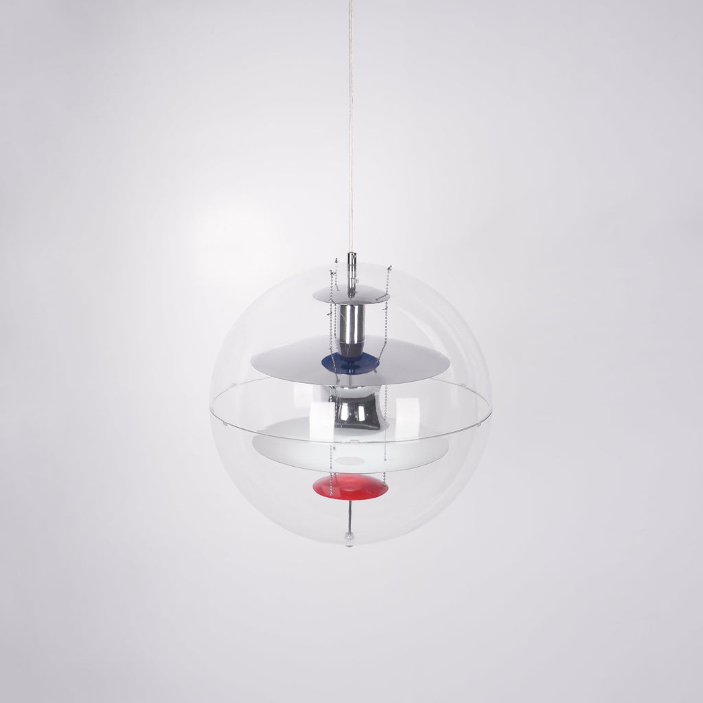 Slightly angled from below, this Clérachic sphere pendant shows chrome and white discs with a red dish inside the acrylic sphere.