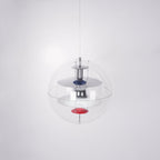 Slightly angled from below, this Clérachic sphere pendant shows chrome and white discs with a red dish inside the acrylic sphere.