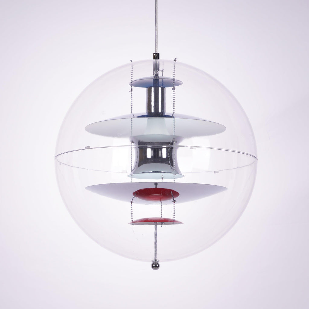 Large close view of this Clérachic sphere pendant, with layered chrome, white and blue discs and a red dish at the bottom.