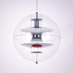 Large close view of this Clérachic sphere pendant, with layered chrome, white and blue discs and a red dish at the bottom.