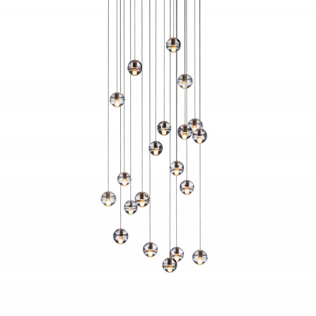 A tall spread of small clear spheres from this Clérachic pendant light on a white backdrop, hung at many different heights.