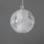 One unlit sphere of this Clérachic pendant light on a chrome cap and white cord, with fine bubbles in the clear glass.