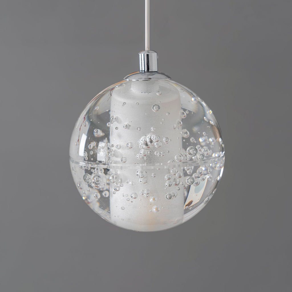 A closer view of a single unlit sphere on this Clérachic pendant light, showing the frosted core inside the bubbled clear glass.