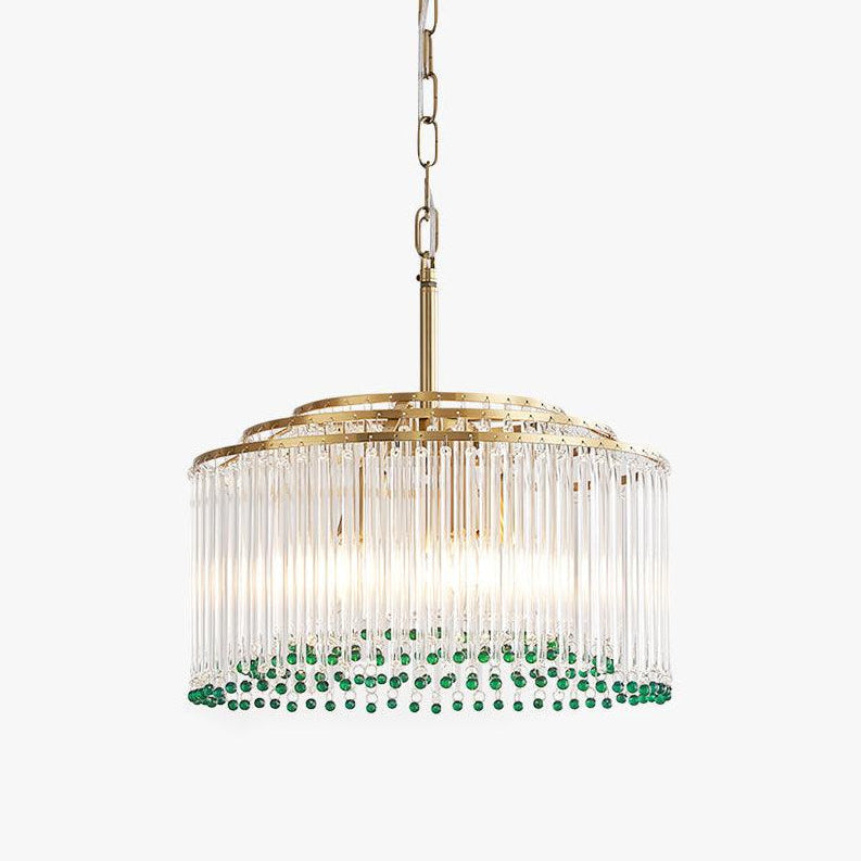 A Clérachic clear glass rod chandelier with a gold tiered frame, green beads along the lower rim and a chain, on a white backdrop.