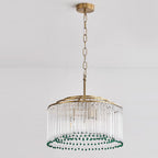 This Clérachic glass rod chandelier hangs from a gold ceiling plate on a chain, its green beads circling the lower edge.