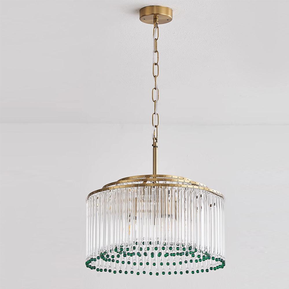 This Clérachic glass rod chandelier hangs from a gold ceiling plate on a chain, its green beads circling the lower edge.