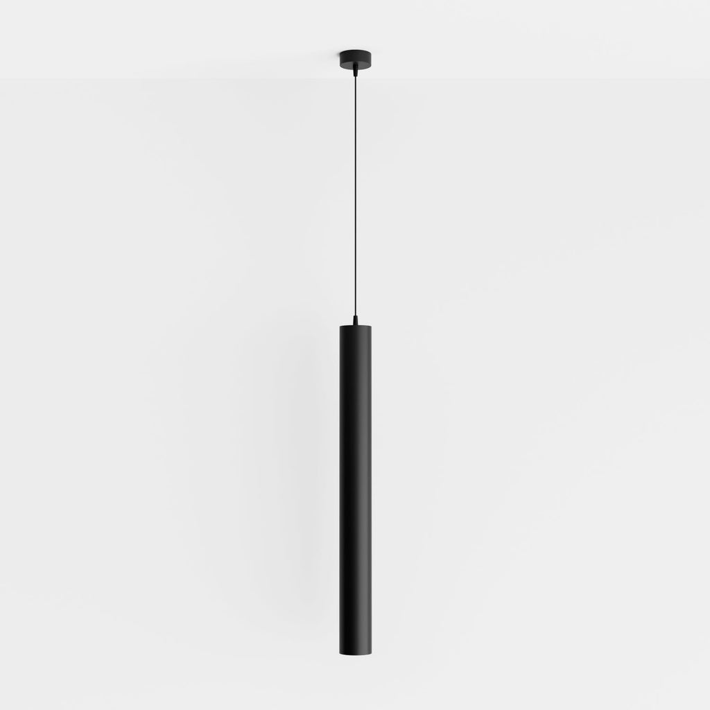 Clérachic cluster pendant light in matte black hangs from a round ceiling canopy on a plain white wall backdrop.