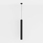 Clérachic cluster pendant light in matte black hangs from a round ceiling canopy on a plain white wall backdrop.