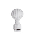 Clérachic table lamp on a white background, its rounded ribbed shade above a narrow stem and a dark wooden base.