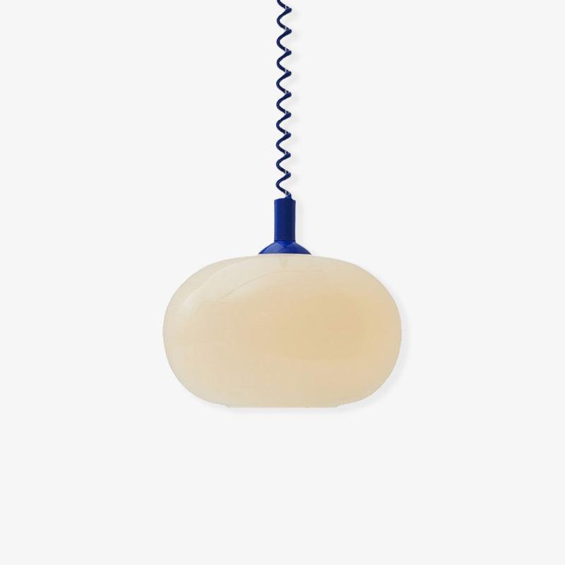 Blue-capped Clérachic pendant with a pale cream shade photographed on a white backdrop, with the coil cable running up.