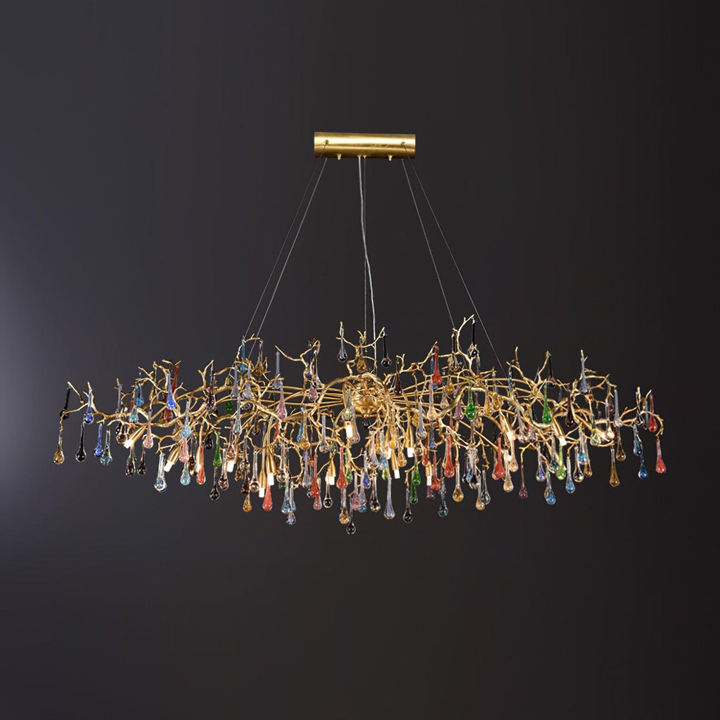 The Clérachic raindrop chandelier fuller on black, coloured glass drops massed under gold branches.