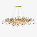 The Clérachic raindrop chandelier on white, coloured glass teardrops along the full gold span.