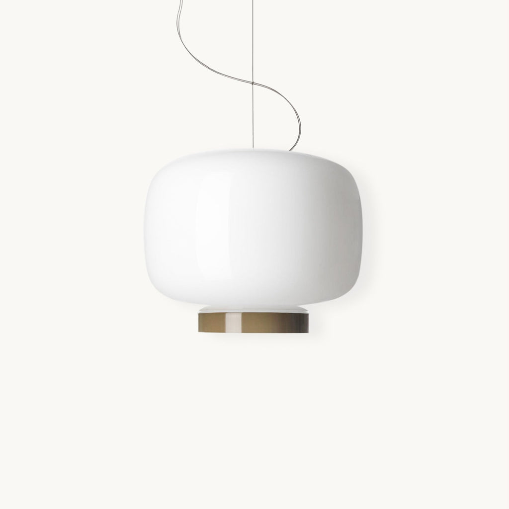 Glossy white glass lantern shade with a slim metal band beneath it, this Clérachic pendant shown on a plain white backdrop.