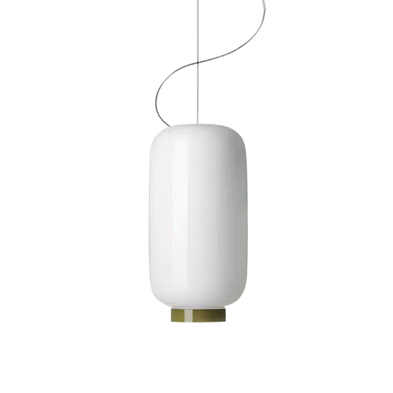 Tall white glass cylinder shade with a green band at its base, this Clérachic pendant on a plain white backdrop.
