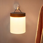 Clérachic's table lamp listing shows a hanging lantern-style light with a carry strap glowing on a wall hook.
