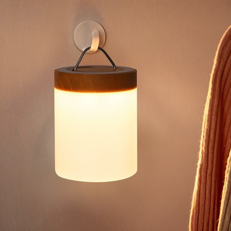 Clérachic's table lamp listing shows a hanging lantern-style light with a carry strap glowing on a wall hook.