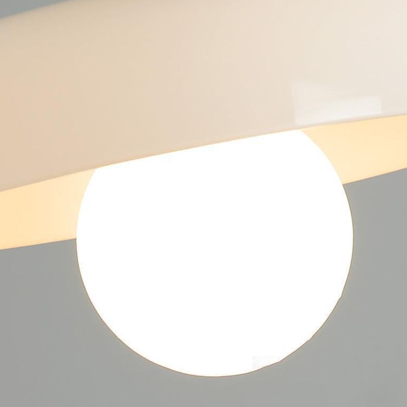 Clérachic white glass drum ceiling light photographed close up, the lit opal globe sitting just below the glossy rim.