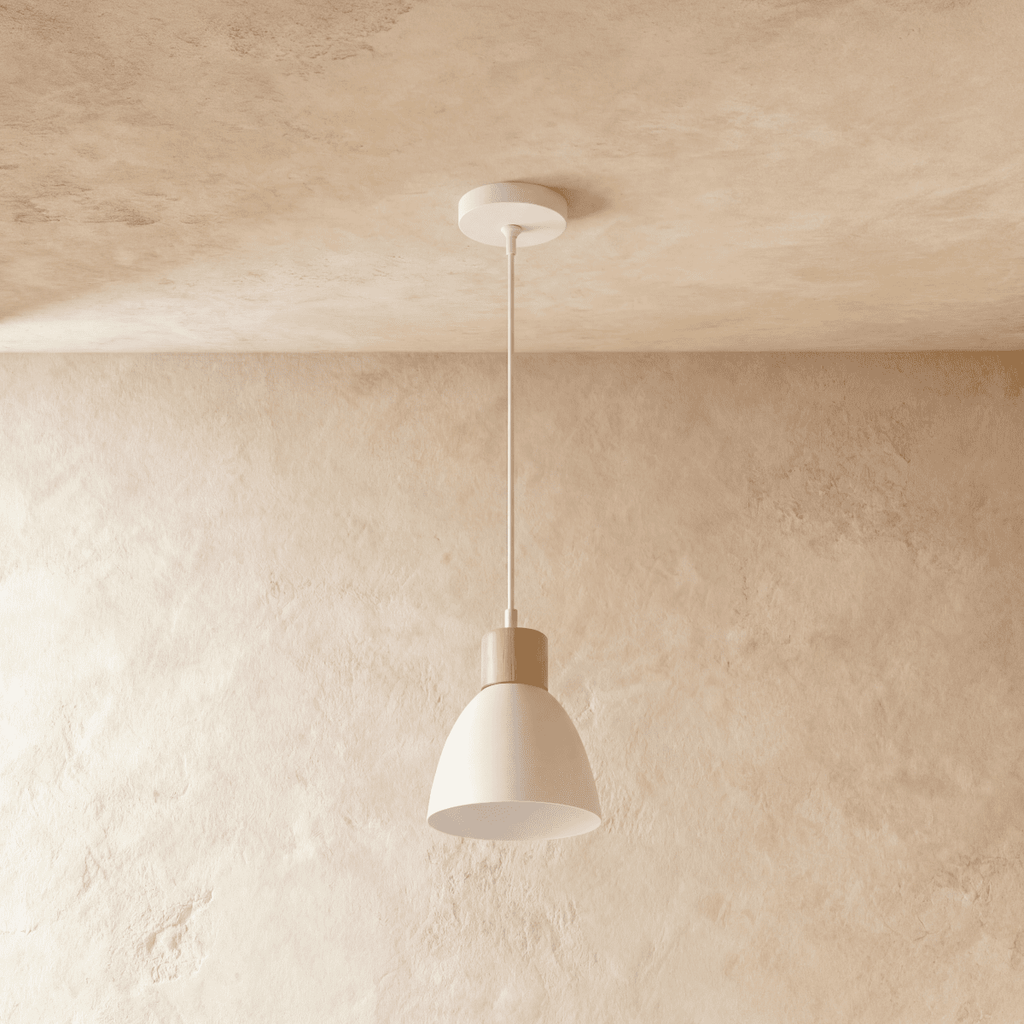 A single Clérachic wood disc pendant light in warm white hangs from a round canopy against a plaster ceiling.