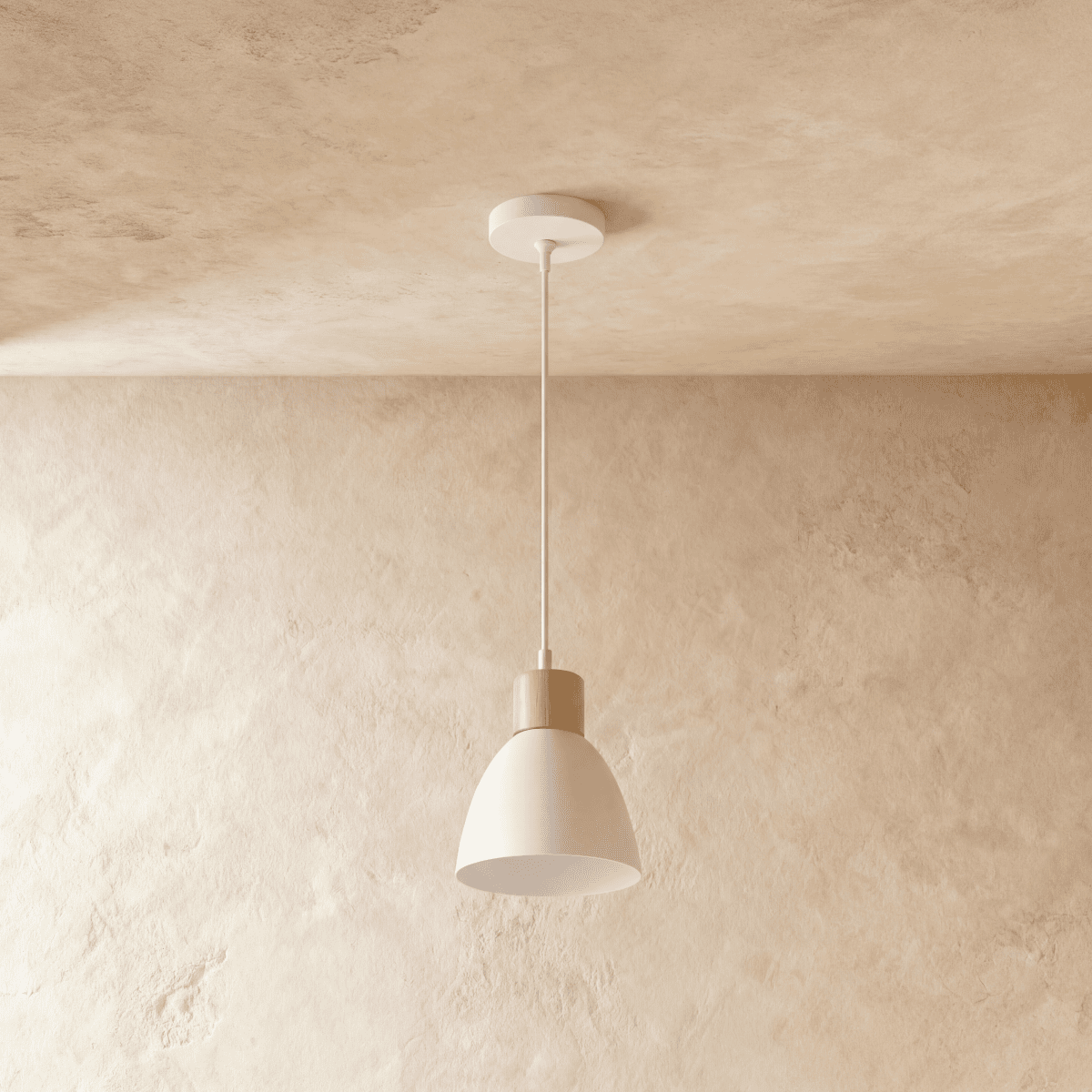 A single Clérachic wood disc pendant light in warm white hangs from a round canopy against a plaster ceiling.