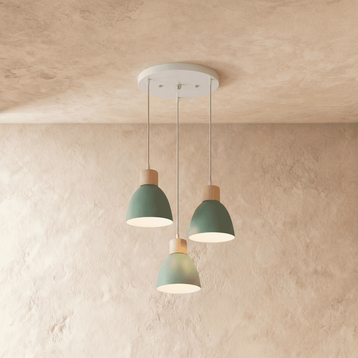 Closer view of the Clérachic three-head green wood disc pendant light cluster on its round white ceiling canopy.