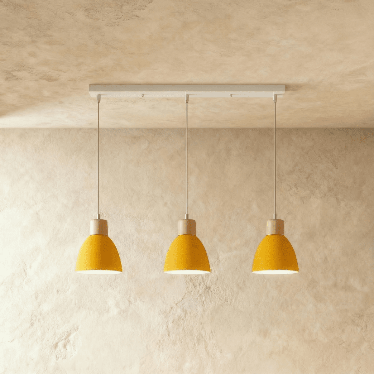 Angled view of the Clérachic three-head yellow wood disc pendant light row hanging from its linear ceiling bar.