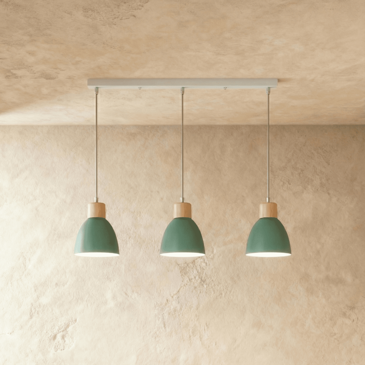 Angled view of the Clérachic three-head green wood disc pendant light row hanging from its linear ceiling bar.