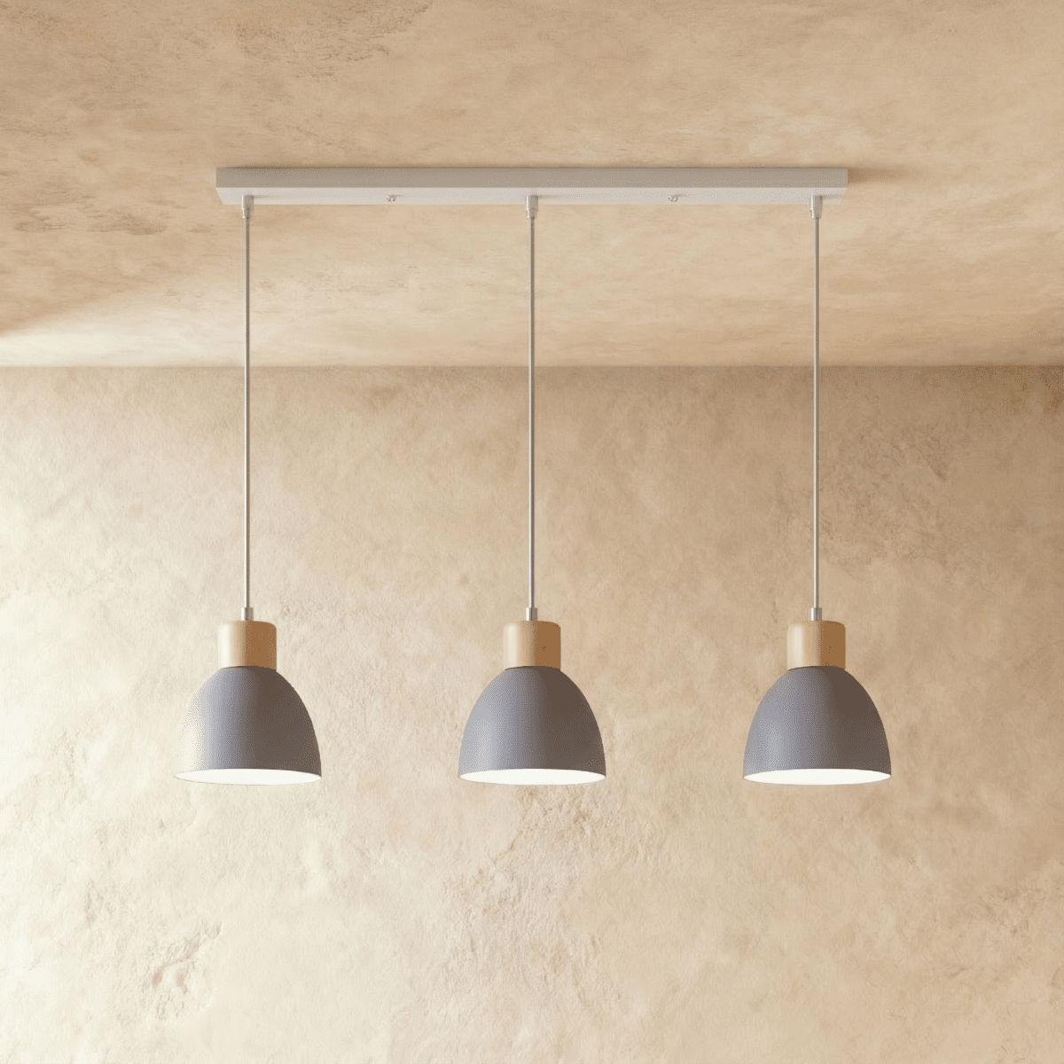 Closer view of the Clérachic three-head grey wood disc pendant light row on its slim linear ceiling bar.