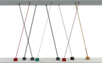 Render of several thin Clérachic floor lamp strips crossing between a ceiling panel and floor, one base shown in green.