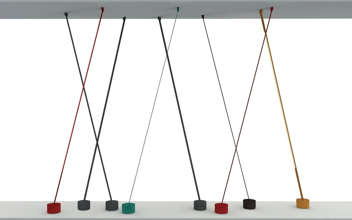 Render of several thin Clérachic floor lamp strips crossing between a ceiling panel and floor, one base shown in green.