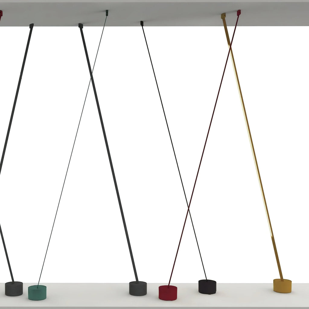 Render of Clérachic floor lamp strips of different widths crossing between a ceiling panel and bases in green, black, red and gold.