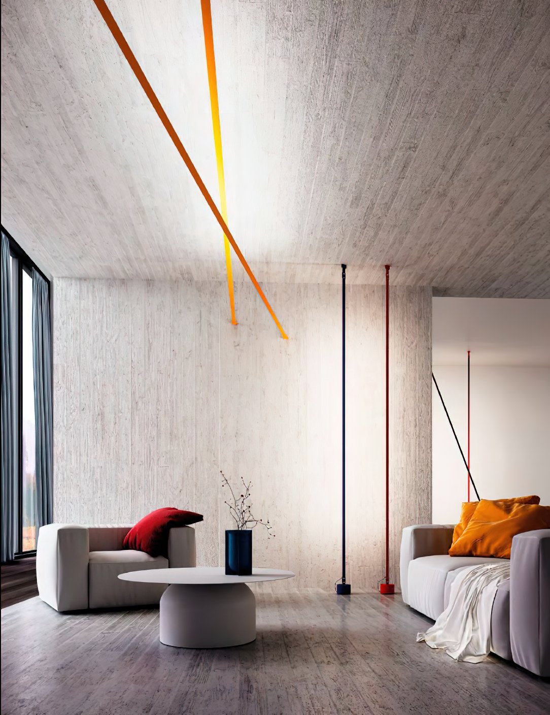 Lit ochre strips of this Clérachic floor lamp angle across a concrete ceiling above a living room with a blue vase and a grey sofa.