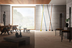 Far view of four Clérachic floor lamp strips leaning on a stone wall in a calm living room, with wooden chairs and a large window.