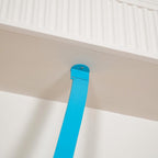A small light blue metal plate fixes the top of this Clérachic floor lamp strip to the underside of a white ceiling beam.