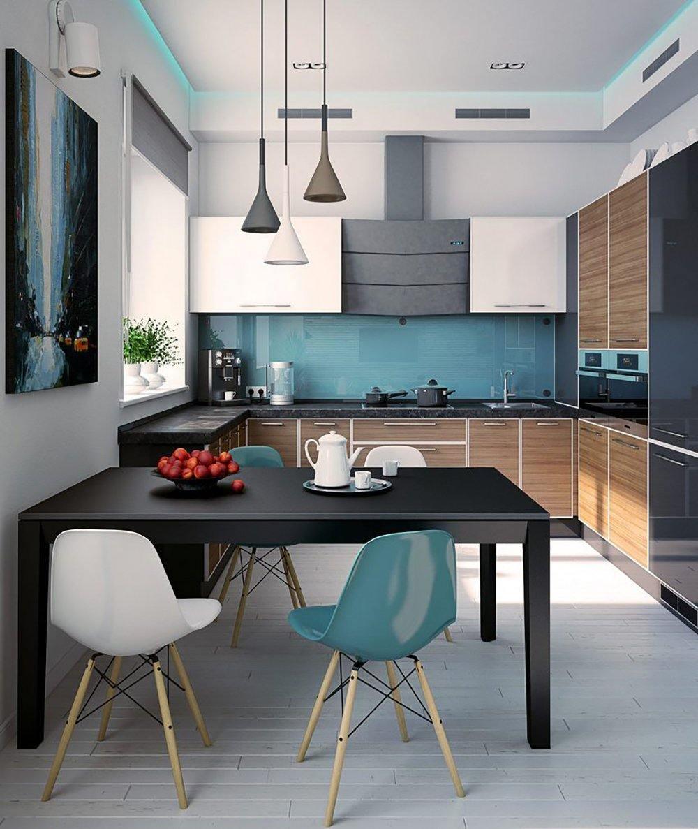 Three Clérachic cone pendants hanging above a black table in a bright kitchen with a teal splashback and teal and white chairs.
