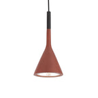 A red-brown Clérachic cone pendant with a black cord sleeve and a gold-toned inner shade, on a plain white backdrop.