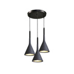 Three black Clérachic cone pendants hung from a round black canopy at different heights, on a white backdrop.
