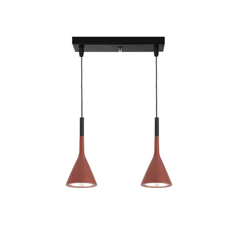Two red-brown Clérachic cone pendants hung from a short black bar, with their cord sleeves in black.