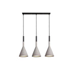 Three concrete grey Clérachic cone pendants hung in a line from a long black bar, with a gold-toned inner shade in each.