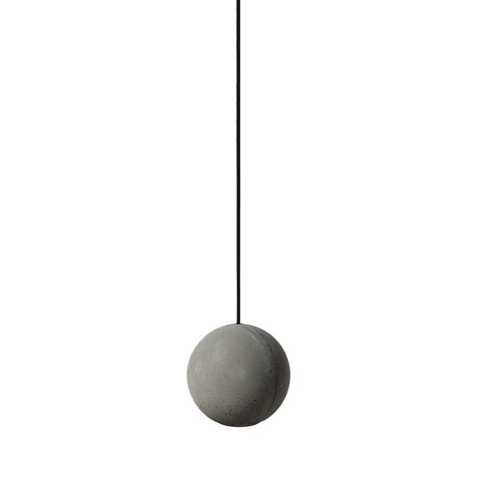 A single cement-grey Clérachic concrete sphere on a black cord, its fine surface texture clear against white.