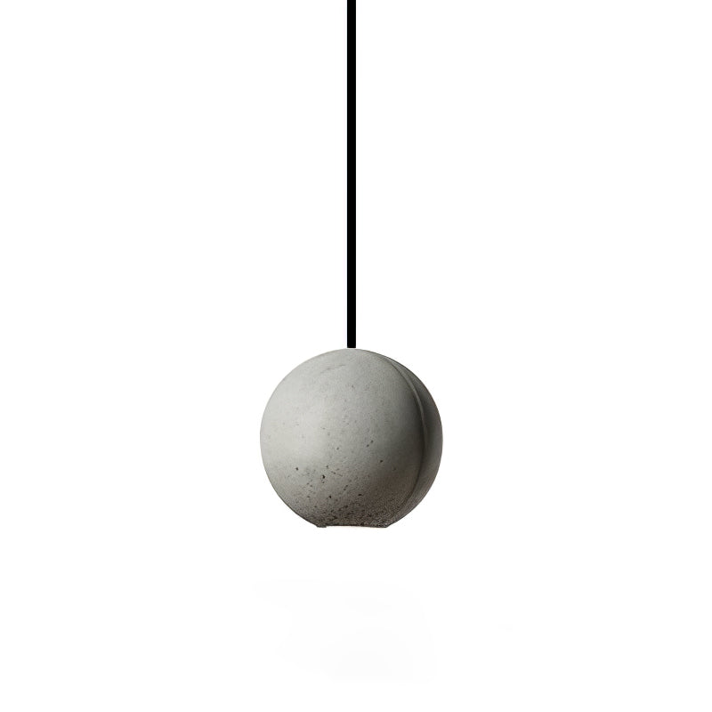 A cement-grey Clérachic sphere pendant on a thick black cord, with a small round opening at its base.