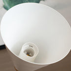 Looking up into the white inside of this Clérachic wall light's shade, showing the lamp holder at the centre.
