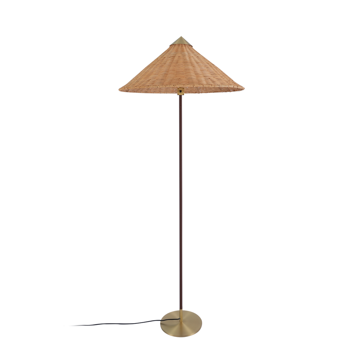 A Clérachic floor lamp with a rattan cone shade and a dark brown stem, its cord at the base, on a black backdrop.