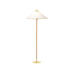 Clérachic floor lamp showing a white cone shade, a rattan-wrapped stem and a thin brass base, on white.