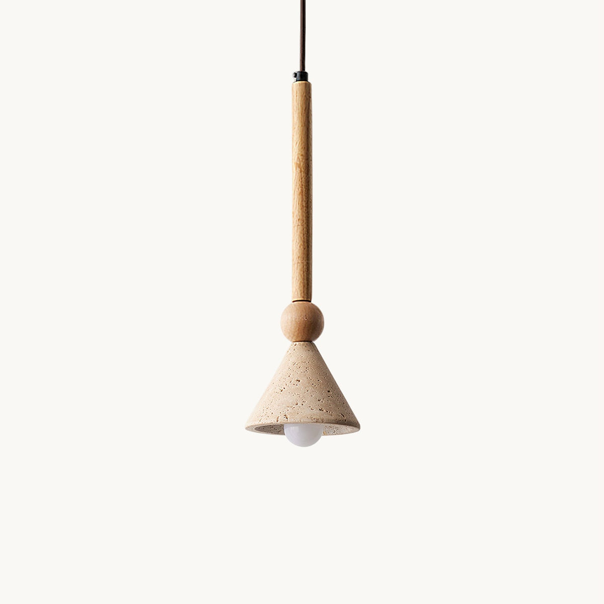 A travertine cone pendant with a bare bulb and a light wooden stem and bead hangs against a plain cream backdrop, from Clérachic.