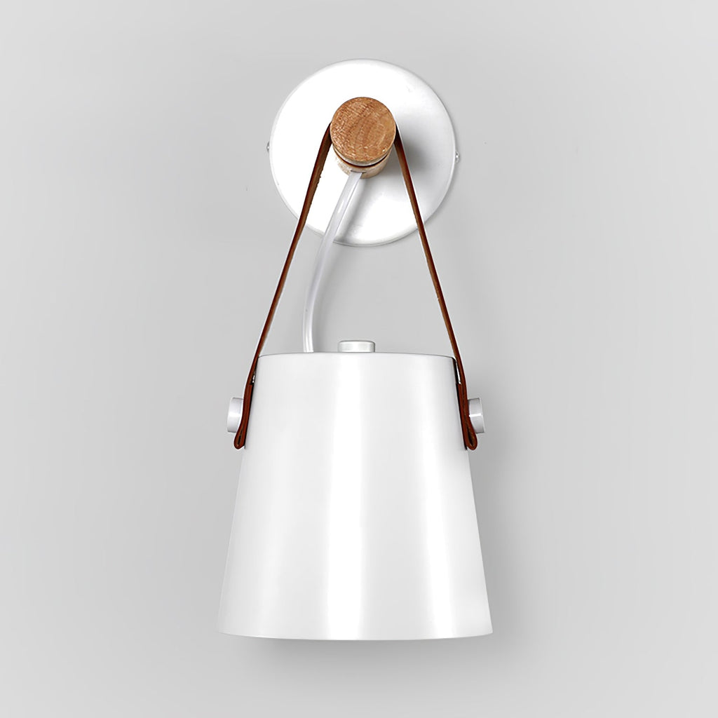 White Clérachic wall light viewed from the front, the strap rising to a wooden pin on a round white wall plate.